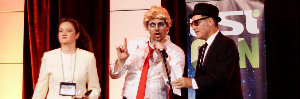 people in costume at the Halloween party: Hillary Clinton, Zombie Donald Trump, and a Blues Brother